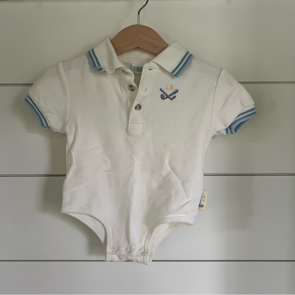 White embroidered baby polo bodysuit